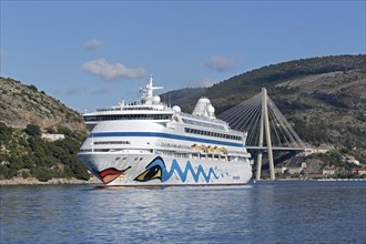 Cruise liner AIDAaura with Franjo-Tudman Bridge