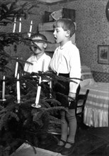 2 boys singing christmas tree