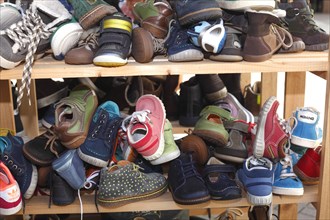 Children's shoes in a shelf