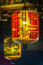 Traditional Chinese lanterns hanging from the ceiling