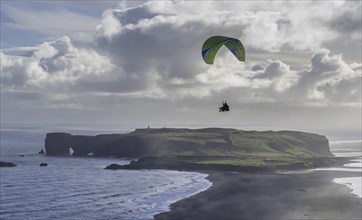 Paragliding over the peninsula Dyrholaey