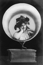 Woman mounted in a gramophone