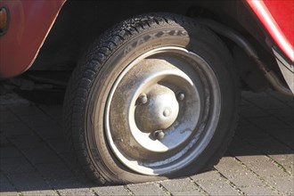 Flat tire on vintage car