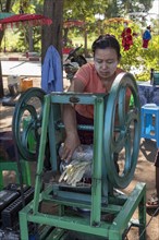 Street vendor of sugar cane juice with machine