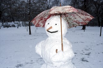 Snowman with umbrella