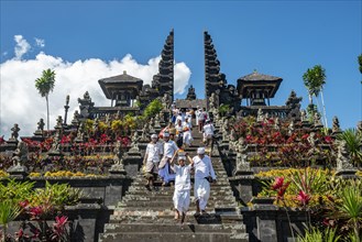 Devout Balinese descend stairs