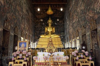 Ubosot with Buddha statue Phra Putthra Tri Lokachet and murals