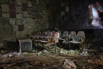 Cinema chairs in a destroyed building