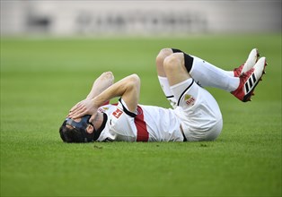 Christian Gentner of VfB Stuttgart lying injured on the ground