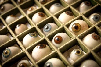 Artificial glass eyes in a box