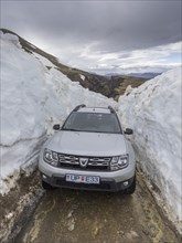 Car driving to the hot spring area Hveradalir through snow