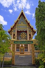 Building of the temple Wat Phra Thong with Wheel of Fortune
