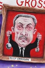 Turkish president Recep Tayyip Erdogan holds chains
