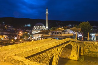 Stone bridge over Bistrica river and Sinan Pasha Mosque at early morning