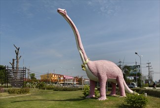 Dinosaur figure at the entrance of the village