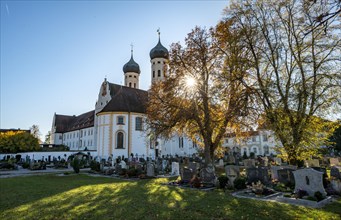 Monastery church Sankt Benedikt and Benediktbeuren monastery with cemetery