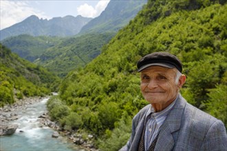 Old man in front of river Cem i Vuklit