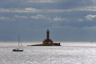Lighthouse with sailboat