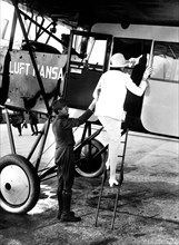 Woman boarding a Lufthansa passenger plane