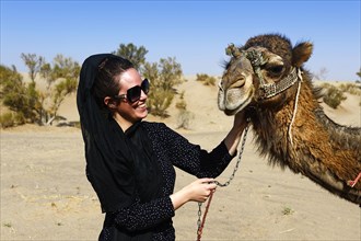 Tourist with camel on camel tour