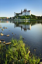 Castle hill with Cathedral and Albrechtsburg Castle is reflected in the river Elbe