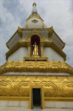Golden Buddha statue in the tower of the Phra Maha Chedi Chai Mongkhon Pagoda