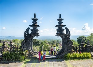 Young Balinese women at the gateway to a temple