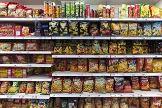 Snacks and chips in a supermarket shelf