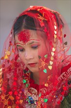 Nepalese bride from the Tharu ethnic group in traditional attire