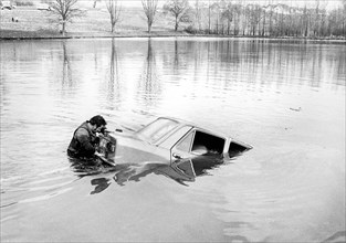 Man with car in the water