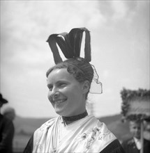 Woman in traditional traditional costume with hat
