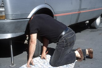Man repairs car