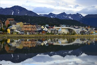 Ushuaia in the evening light is reflected in the Beagle Channel