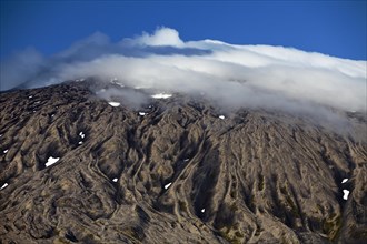 Volcano and glacier Snaefellsjokull with summit in clouds