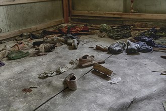 Various shoes and clothes on the ground