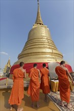 Buddhist monks in front of the Chedi on Phu Khao Thong