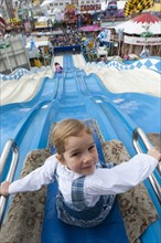 Little girl on giant slide