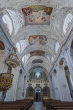 Interior view with organ gallery and ceiling frescoes and stucco