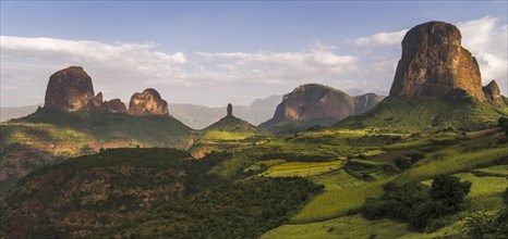 Rock formations and fields at the edge of Simien Mountains national park