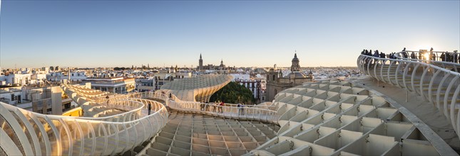 View from Metropol Parasol to numerous churches at sunset