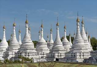 Row of white stupas at Sandamuni Pagoda