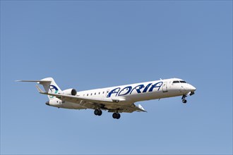 Bombardier CRJ-701 of the airline Adria Airways during landing approach