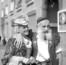 Woman and man dressed in traditional costumes