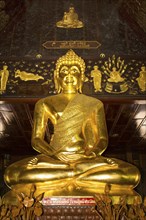Golden Buddha statue in the Bot of Wat Phuttha Nimit Phra Saiyat