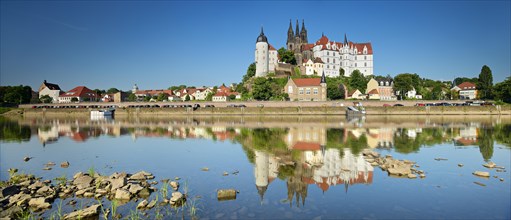 Castle hill with Cathedral and Albrechtsburg Castle is reflected in the river Elbe