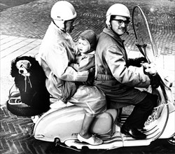 Family with dog on motorcycle