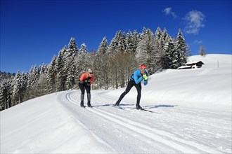 Olympic silver medalist Tobi Angerer with his wife Romy on the cross-country ski trail of Winklmoos-Alm