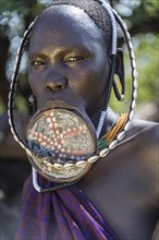 Woman with lip plate from the Mursi tribe