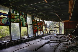 Destroyed building with colorful glass windows