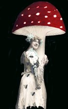 Woman embraces huge fly agaric